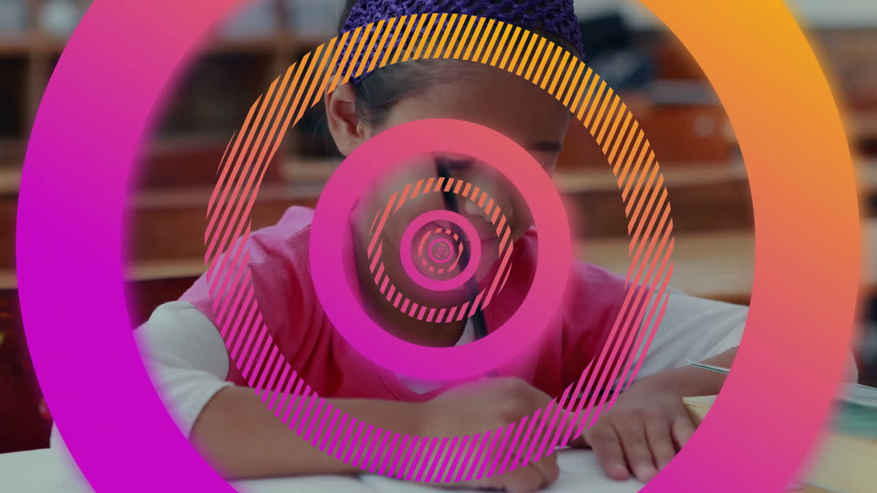 In school, child drawing with colorful circular animation overlay in classroom