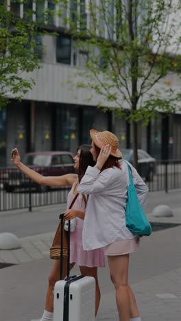 two women taking a selfie while traveling