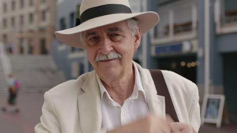 portrait of stylish elderly man tourist smiling cheerful enjoying urban sightseeing travel wearing white suit