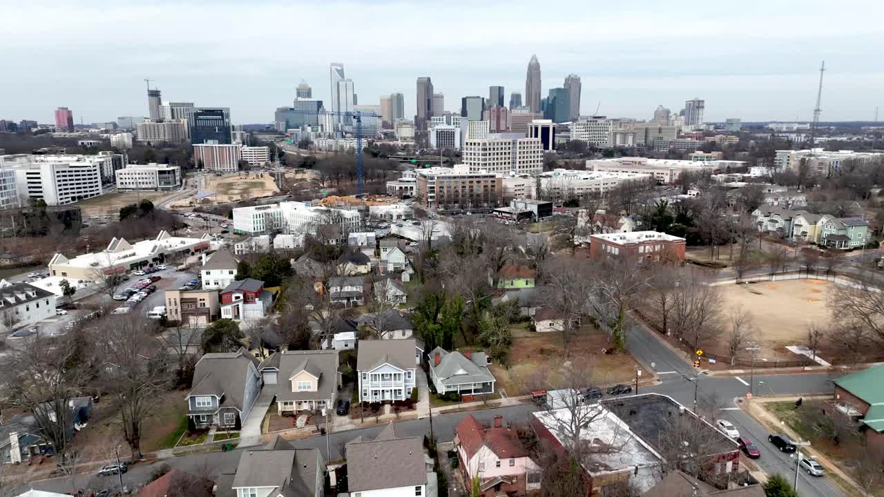 aerial pullout over homes and neghborhoods from charlotte north carolina skyline