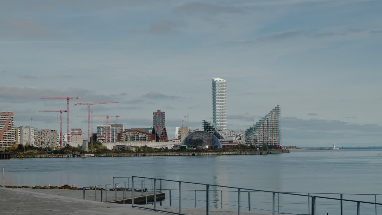 Modern Aarhus skyline with waterfront view. Ideal for urban development and travel documentaries.