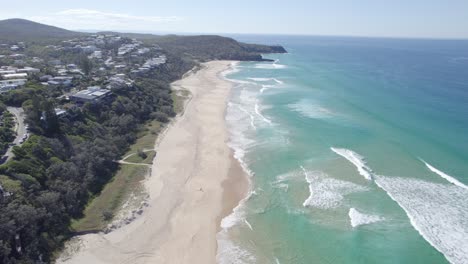 waves coming to the shoreline of sunshine beach in summer in noosa heads, queensland, australia