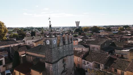 slow rising shot showing the mudaison city town hall in occitanie