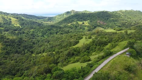 lush green mountainous road view in the philippines