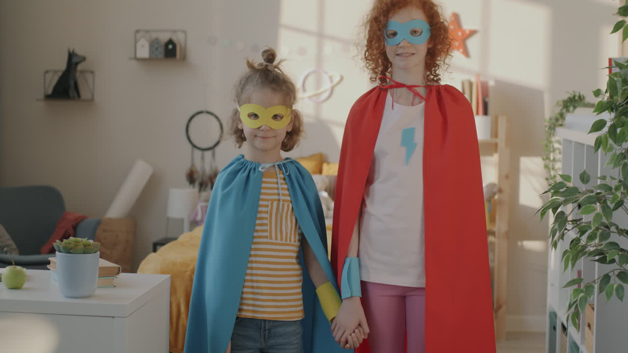 Two Children Dressed as Superheroes