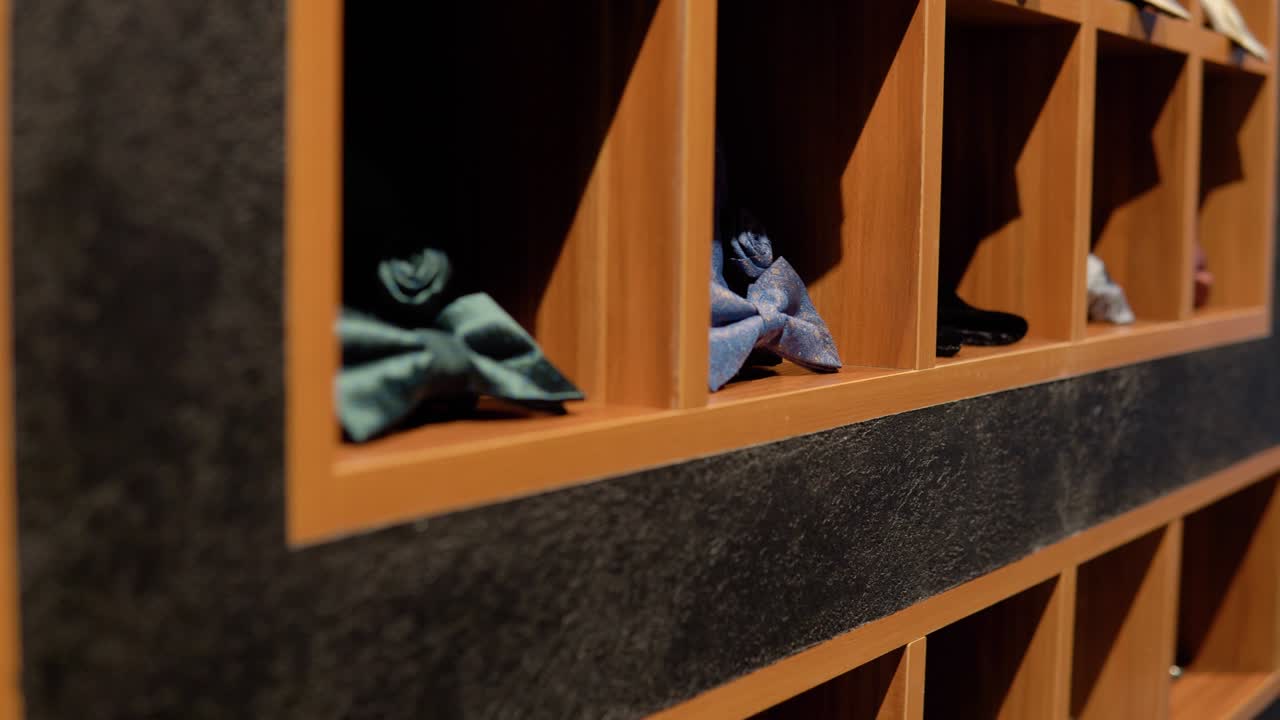 Showcase with bow ties in luxury boutique of men's clothing and suits