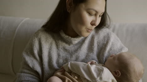 mother holding newborn baby