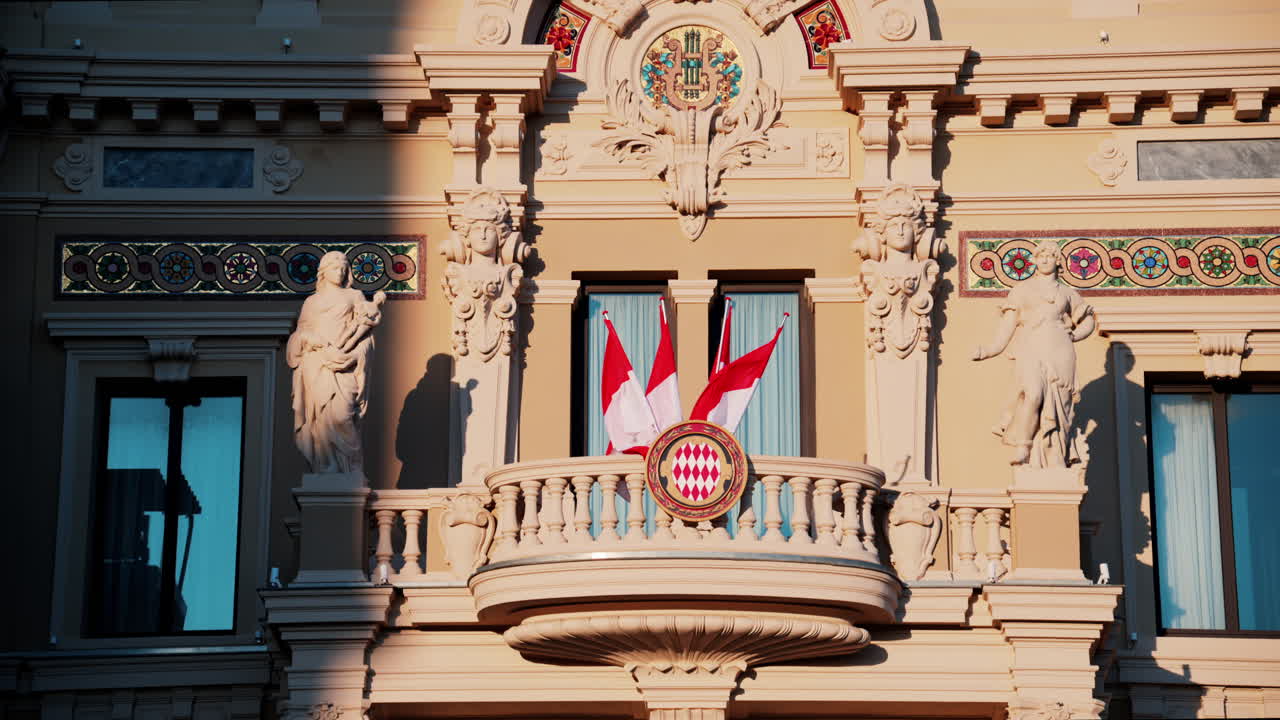 Monte Carlo, Monaco - October 24, 2024: The coat of arms of Monaco and multiple flags waving on the Monte Carlo Casino