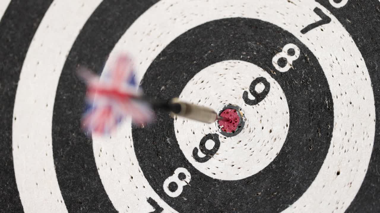 Dart with british flag in middle of playing dart board 4k movie