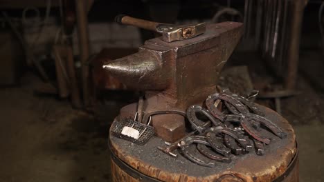 blacksmith's anvil and horseshoes