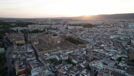 panning aerial view of mosque-cathedral in cordoba, spain during blue hour