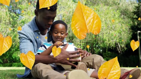 Animation-of-falling-yellow-over-african-american-father-and-son