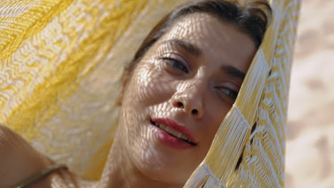 calm girl daydreaming hammock in sunlight closeup. pretty woman enjoying summer