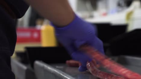 local butcher making delicious raw sausages, close up view