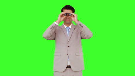 Businessman-looking-through-binoculars