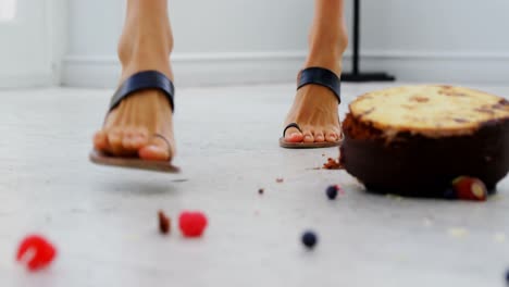 Cake-falling-in-front-of-womans-feet