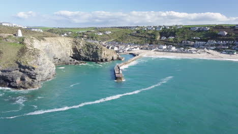 turquoise waters and tranquil landscape of portreath cornwall in summer - aerial wide shot