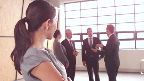 Smiling-businesswoman-with-arms-crossed