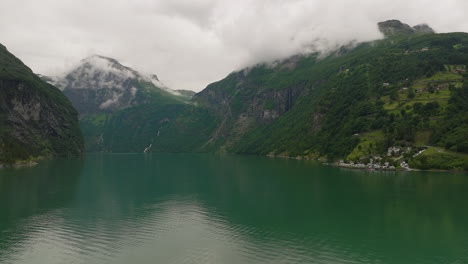 geirangerfjord is surrounded by majestic mountain peaks in norway