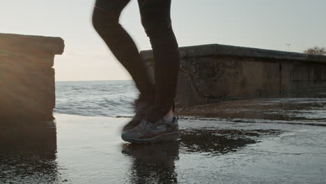 Violent-Sea-Waves-Crashing-on-the-Wall,-Splashing-Water-to-the-Ground-on-Sunny-Day-in-slowmo