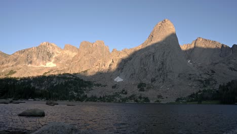 stunning view of cirque of the towers in wyoming’s wind river wilderness, showcasing its towering peaks, static view from water