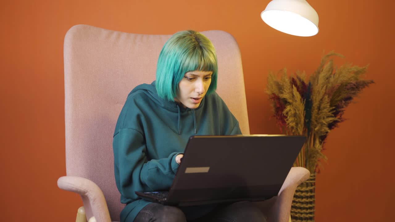 Young woman sending wrong mail on laptop. Can't get mail back.