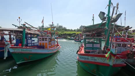 vibrant fishing boats floating in a calm bay