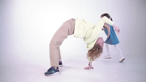 mother and daughter playing yoga