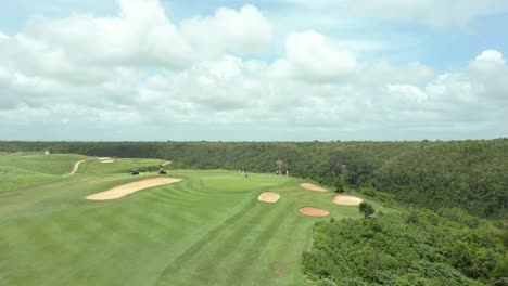 aerial view flying over a caribbean golf course, sunny day in dominican republic