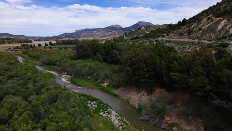 mountains and river flowing in estepona, aerial drone view