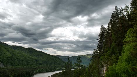 clouds on the horizon, running through the sky in the mountains.