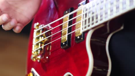 closeup of a hand playing a bass guitar slapp style