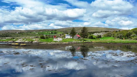 Drone-flying-over-little-creek-to-pretty-little-house,Adrigole-West-Cork-Ireland,popular-tourist-spot-on-the-Wild-Atlantic-Way