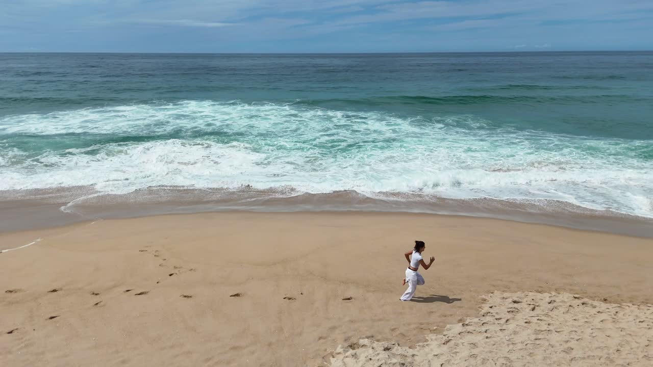 Woman running on a sandy beach