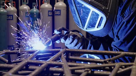 welding metal frame in industrial setting