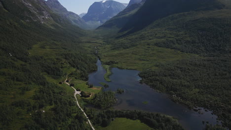 aerial view of tourist cabins by the lakeshore in innerdalen valley, norway