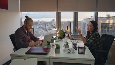 focused managers talking together at room closeup. business team working sunset