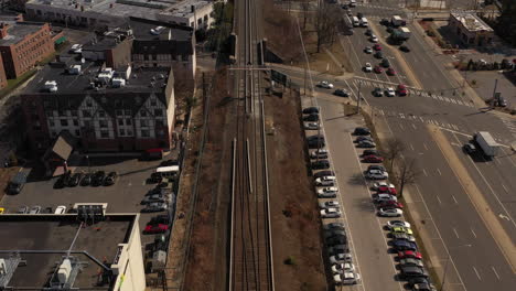 a top down shot of train tracks on a sunny day