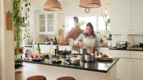 couple cooking together in a kitchen