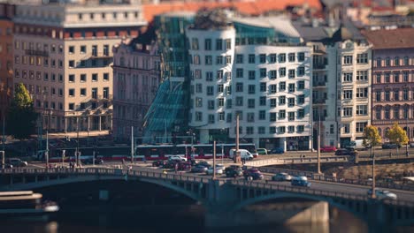 busy traffic on the miniaturized crossroad in front of the dancing house in prague