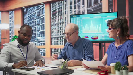 senior woman reads the new retirement plan contract in a meeting with broker