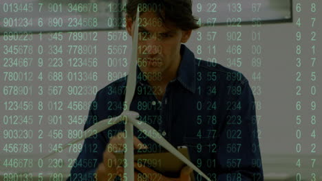 screen with data processing against caucasian male engineer using digital tablet