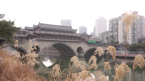 anshun bridge over the jin river with modern skyline skyscraper building on background chengdu capital city of the chinese province of sichuan