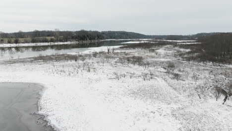 Frozen-Covered-Riverbanks-With-Low-Tide-Water-Near-Neills-Bluff,-Washington-County,-Arkansas,-United-States