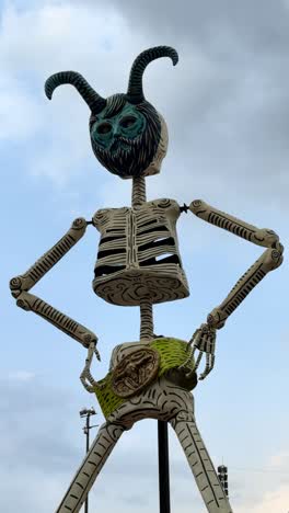 giant skeleton statue with horns - day of the dead art
