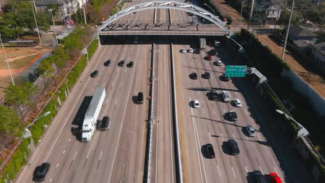 aerial of cars on 59 south freeway in houston, texas on a bright sunny day