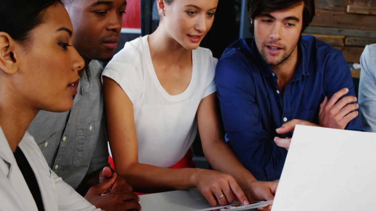 Business executives interacting with each other in meeting