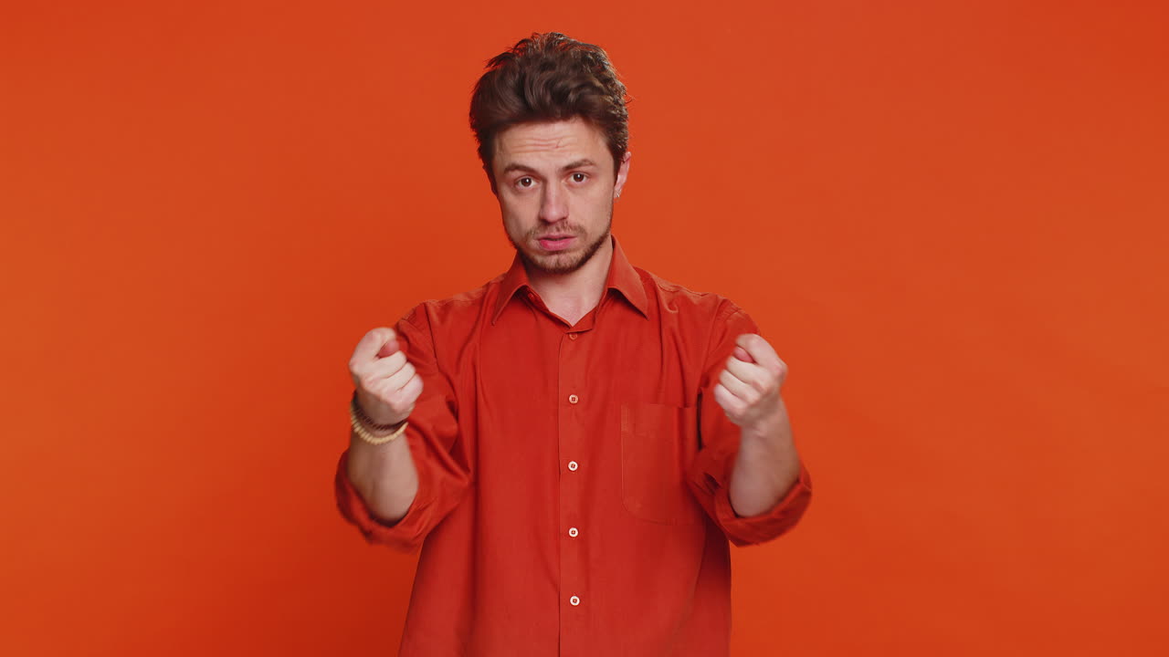 Greedy avaricious man showing fig negative gesture rapacious avaricious acquisitive refusal fig sign