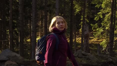 Attractive-young-blonde-woman-enjoys-exploring-the-outdoors-in-Apuseni-Natural-Park,-Romania,-Nature-reserve-1