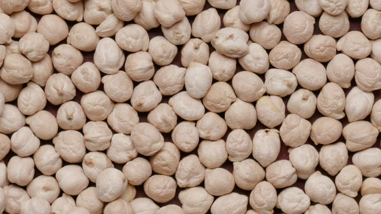 Group of raw chickpeas rotating in а circle